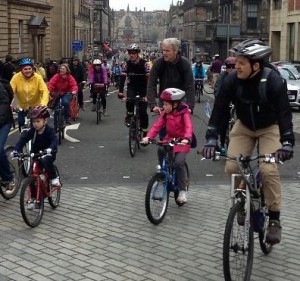 People of all ages cycling to Parliament (photo by Chris Hill on flickr)