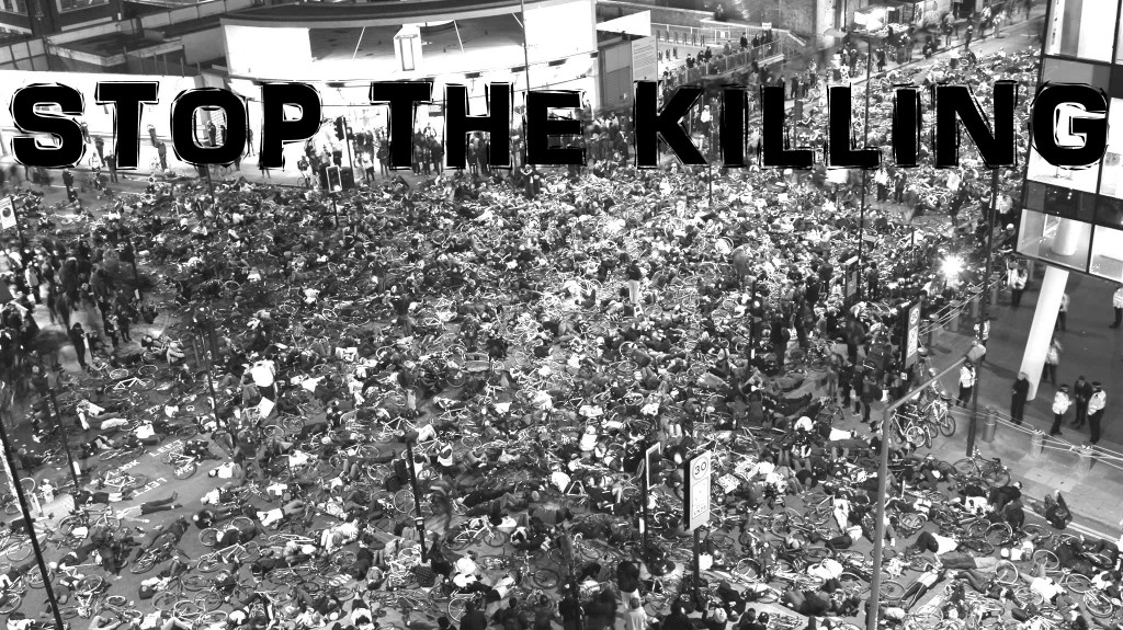 Stop the Killing banner on Rory Jackson's photo of over a thousand people who performed a "die in" on Blackfriars Road in front of the Transport for London headquarters on 29 November 2013.